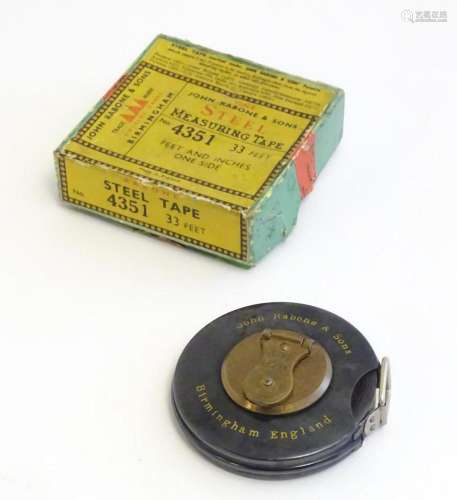 An early 20thC surveyors steel tape measure by John Rabone &...