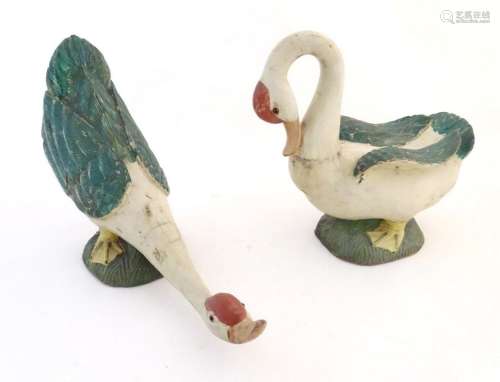 Two primitive carved wooden folk art models of geese with po...