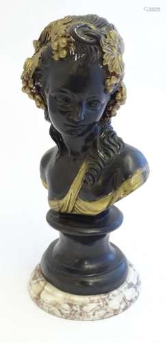 A 20thC cast model of a Bacchanalian lady with grapes and vi...