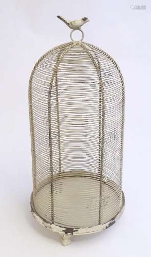 A 20thC wirework bird cage of dome form with a loop handle s...