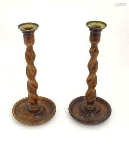 A pair of late 19th / early 20thC candlesticks with barley t...