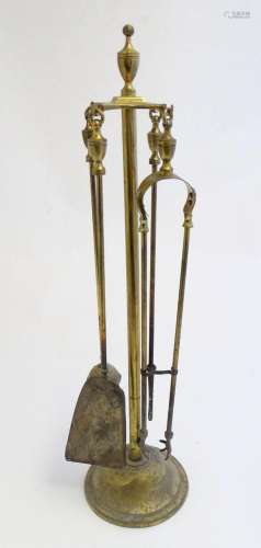 A 20thC brass fireside companion set / fire tools, comprisin...
