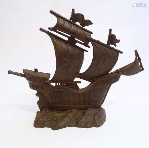 A 20thC cast door stop / door porter modelled as a galleon s...