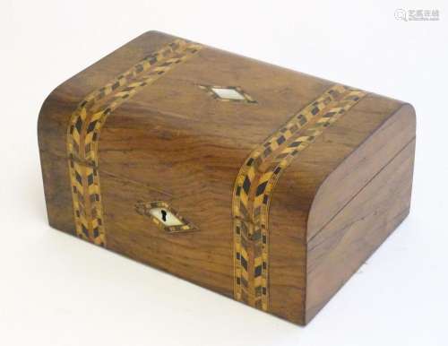 An early 20thC walnut work box with dome top and marquetry /...