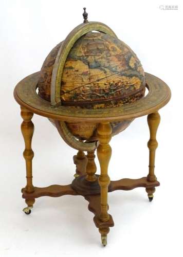 A 20thC novelty drinks cabinet modelled as a globe with appl...