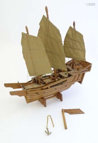 A mid 20thC scratch built wooden model of a boat with canvas...