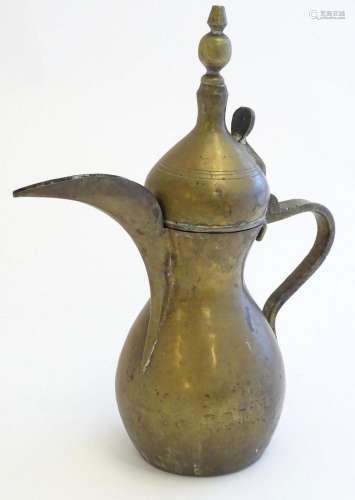 A Middle Eastern / Turkish brass Dallah coffee pot with band...