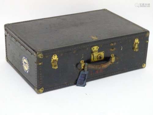 An early 20thC Oshkosh steamer trunk. the leather and wood c...