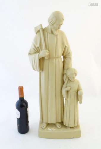 A 20thC Continental plaster sculpture depicting Saint Joseph...