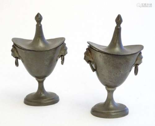 Two 19thC pewter salts modelled as lidded urns with twin lio...