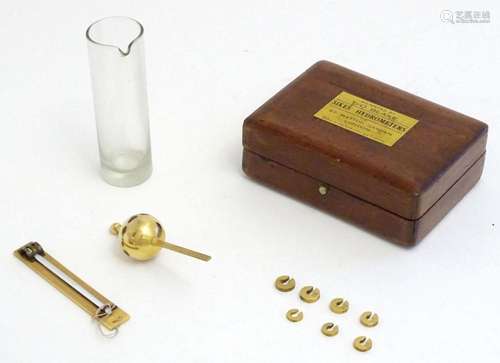 An early 20thC Sikes' Hydrometer comprising a glass mea...