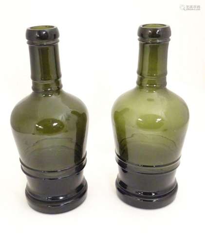 Two olive green glass bottles. Approx 13" high