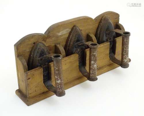 Three 19thC sad irons / flat irons, two marked with CU cyphe...