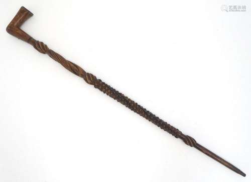 A Victorian carved wooden walking stick / cane with plaque t...