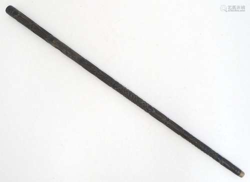 An Indian ebony walking cane / stick with carved detail. App...