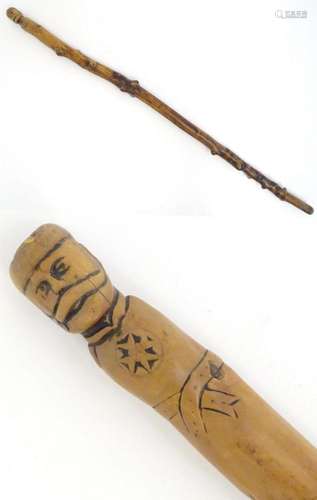 A 19thC German folk art walking cane with carved handle mode...