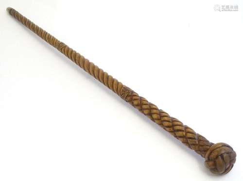 A Victorian carved walking stick / cane with rope detail and...