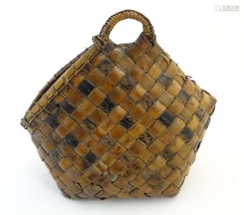 Ethnographic / Native / Tribal : A woven basket. Approx. 15&...