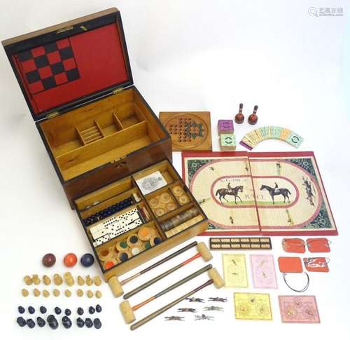 Toys: A late 19th / early 20thC mahogany games box / compend...