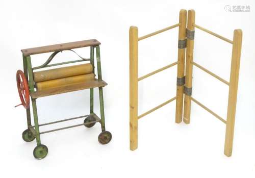 Toys: A 20thC Tri-ang child's toy mangle. Together with...