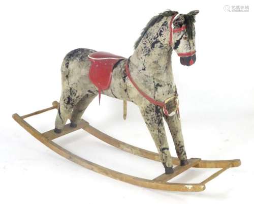 Toy: A 20thC plush rocking horse on bows with red and white ...