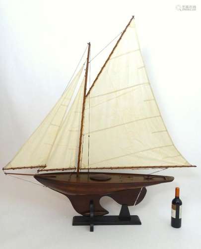 A 20thC model / pond yacht / boat of large proportions, carv...