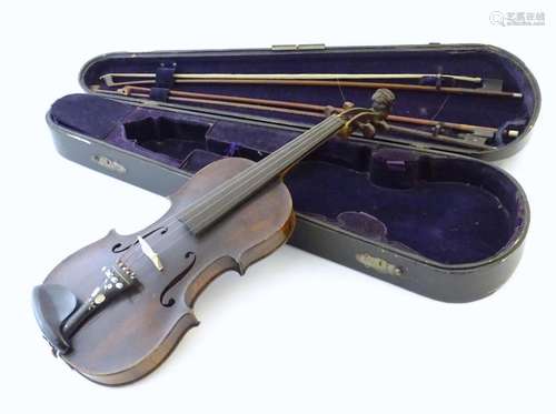 Musical Instruments: a 19thC German violin, of stained maple...