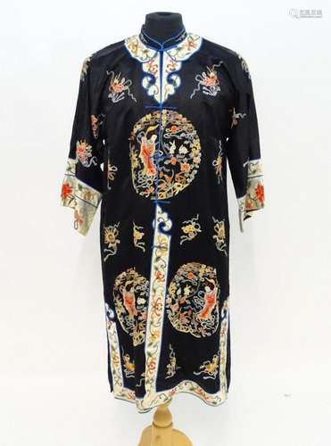 A Chinese informal coat, the black ground embroidered with P...