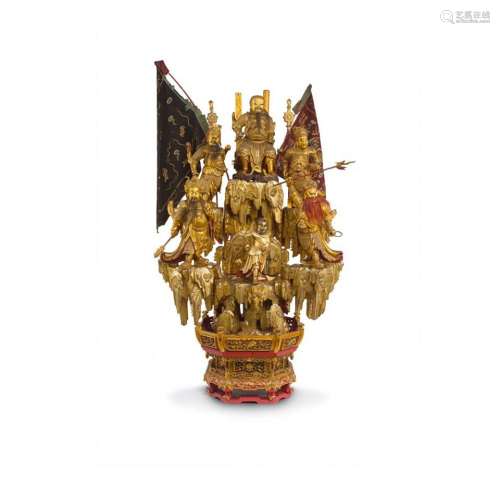 An impressive large carved Chinese giltwood figural group of...