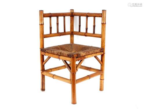 A 19th Century bamboo corner chair, having rush seat