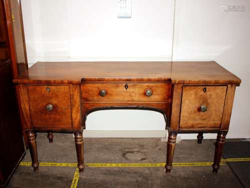 An early 19th Century mahogany breakfront sideboard, fitted ...