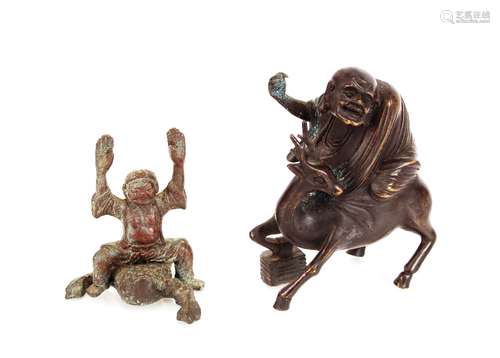 An oriental brone figure, of a Sage riding a deer; and anoth...