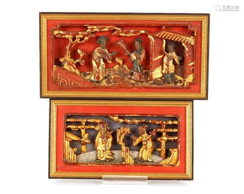 Two Chinese relief panels, with lacquered and gilt decoratio...