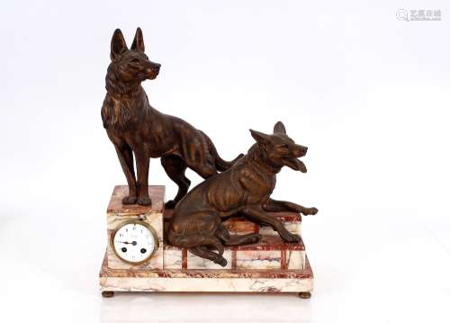 A French marble and bronze clock, surmounted by dogs on a st...