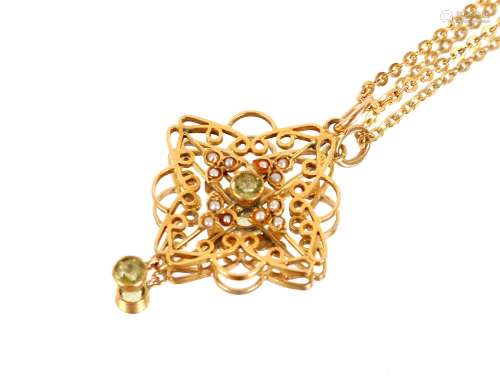 A 9ct gold pendant, set with seed pearls and peridot hung to...