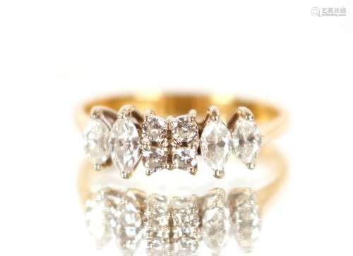 An 18ct gold ring, set with an arrangement of diamonds, size...