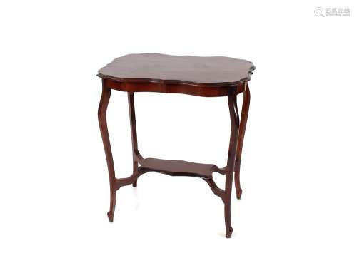 An Edwardian mahogany occasional table, the shaped top raise...