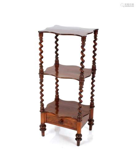 A Victorian rosewood whatnot, raised on barley twist columns...