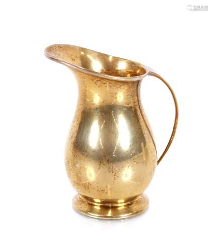 A small silver gilt cream jug, Hallmarked for Birmingham 196...