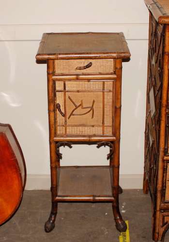 A late 19th Century bamboo bedside cabinet, the over hanging...