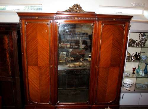 A 19th Century French walnut break front wardrobe, the pedim...