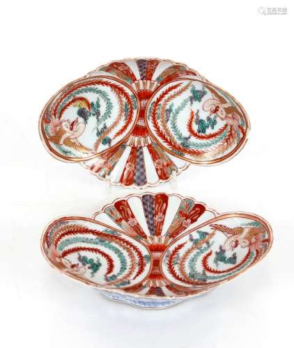 A pair of Imari pattern shell shaped dishes, heightened in g...