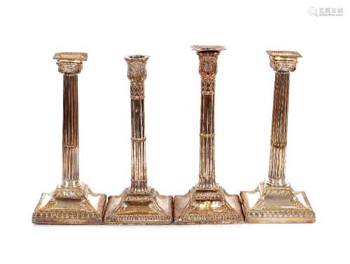 Two pairs of plate on copper Corinthian column candlesticks,...