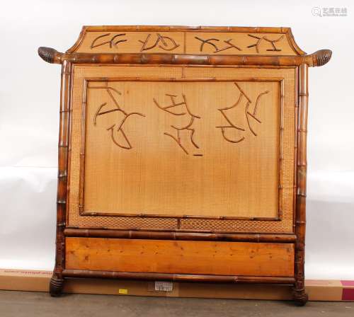 A 19th Century bamboo bed, with shaped rattan panelled ends ...