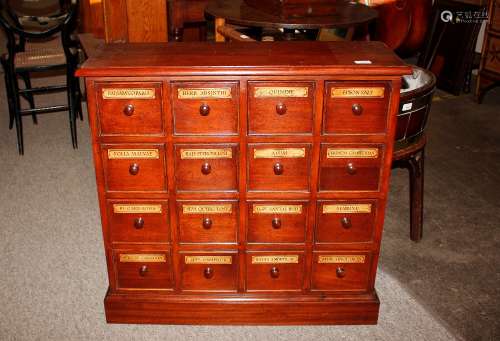 A mahogany Pharmacy cabinet, fitted twelve labelled drawers ...