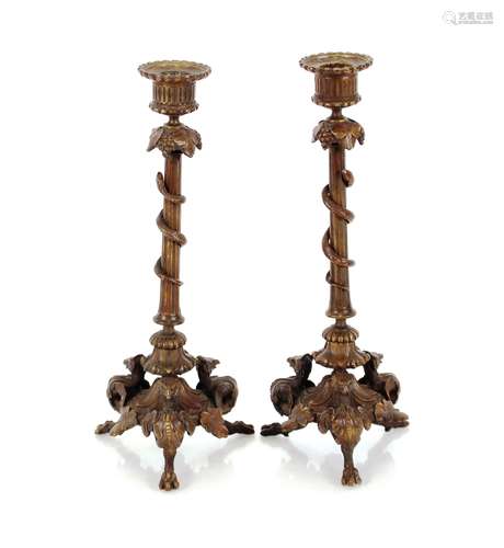 A pair of 19th Century bronze candlesticks, with serpent and...