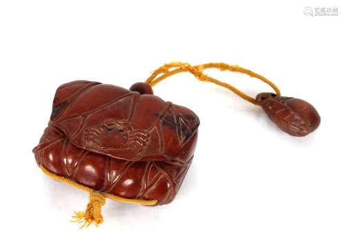 A Japanese wood Inro, decorated with a crab and attached tas...