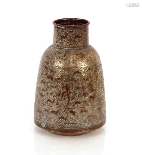 An Eastern copper vase of baluster form, with foliate engrav...