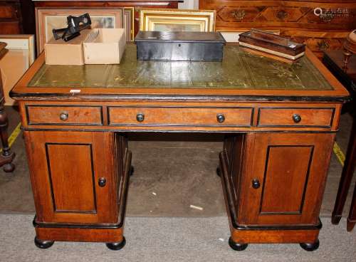 A Victorian golden oak and ebonised pedestal writing desk, t...