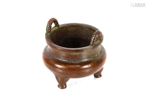 A small oriental bronze censer, with loop handles, 5.5cm dia...